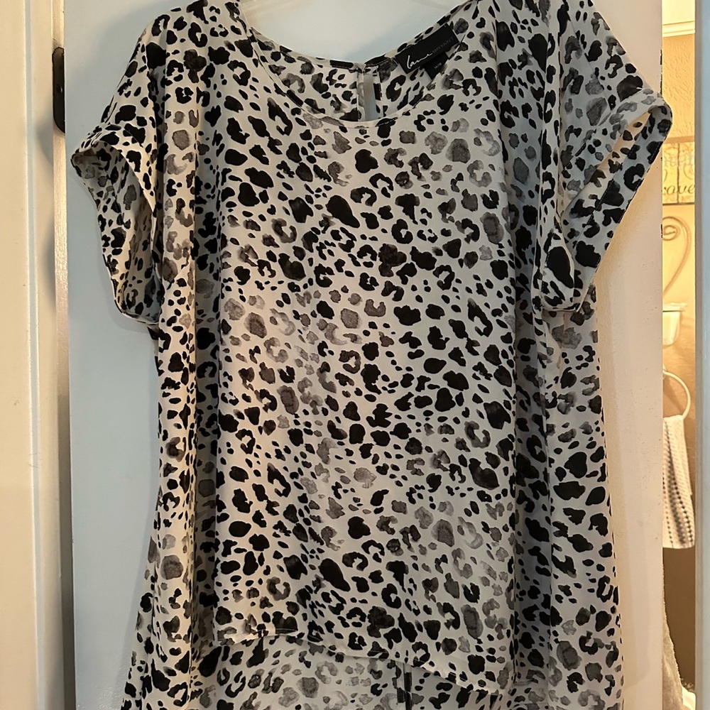 Gray/black high-low cheetah print blouse with split in the back. 14/16 size